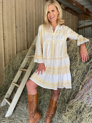 Tall women's ivory Daphne mini dress with gold embroidery on 5'11" model