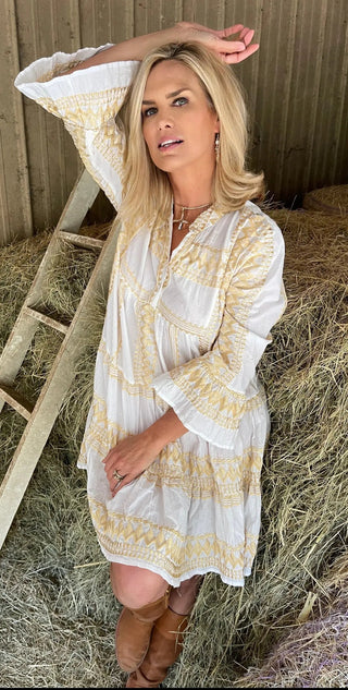 Bell sleeve detail of ivory Daphne tall mini dress with gold accents