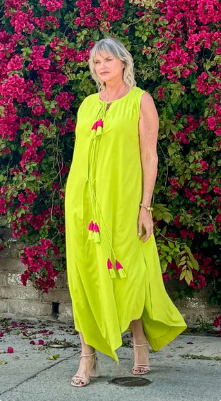 Jezebel Maxi Dress, an on-trend cocktail dress that’s designed to make a bold statement. With its vibrant lime green color and stylish details, this dress is perfect for tall women who love to stand out.  Chic and Edgy Design:  Flirty and Flowy Hem: The flirty and flowy hem adds a playful touch, ensuring you turn heads wherever you go. Edgy Slit: The edgy slit adds a daring element, perfect for showing off your legs and adding movement to your stride. Vibrant Lime Green: The punchy lime green color is bold 