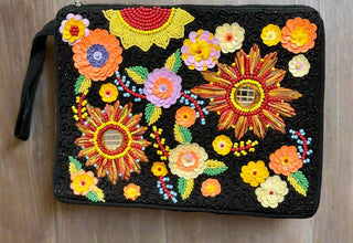 Unleash your inner fashionista with our elegant Clutch Purse! Featuring a top zip for secure storage, and hand-beaded black detailing adorned with vibrant 3D floral appliques. Bring a touch of color and sophistication to any outfit with this must-have accessory.  SIZE: 12"X 9"