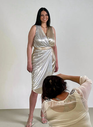 Gold and Silver Shimmer Satin: The luxurious liquid shimmer satin fabric blends the glamour of gold and silver, creating a stunning visual effect that captures attention. Flattering Wrap Design: The classic wrap design accentuates your curves, offering a flattering fit for any body type. This elegant style ensures you look and feel your best.