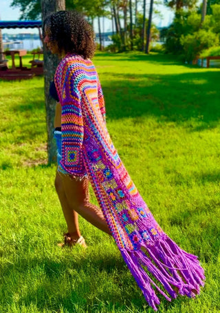 Full-length view of pastel rainbow crochet duster on 6' model
